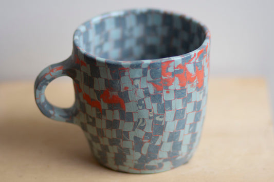 blues and orange mug
