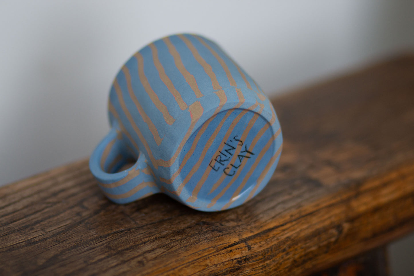 blue and orange striped mug