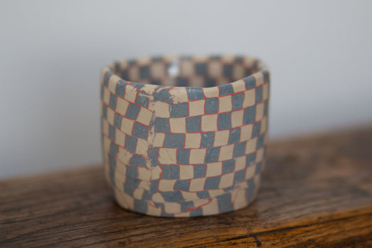 blue and white checkered tea cup