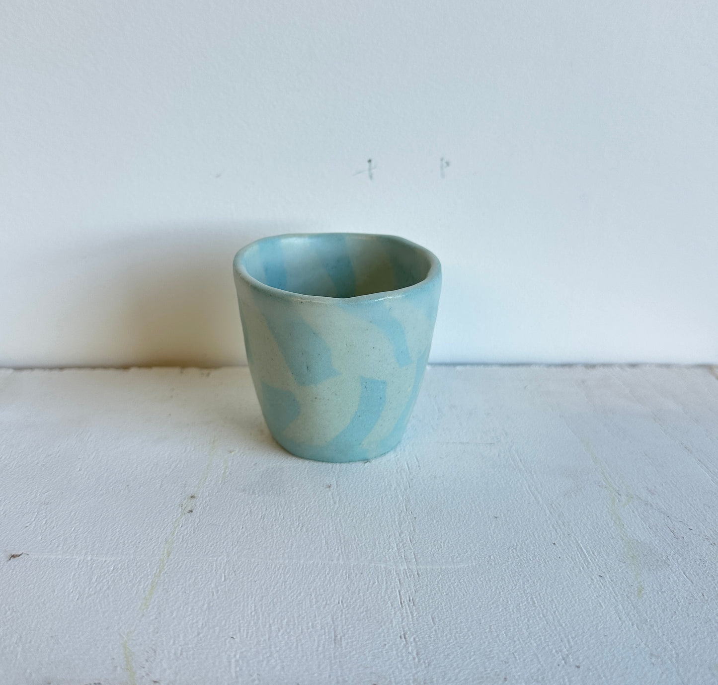 tiny blue checkered cup