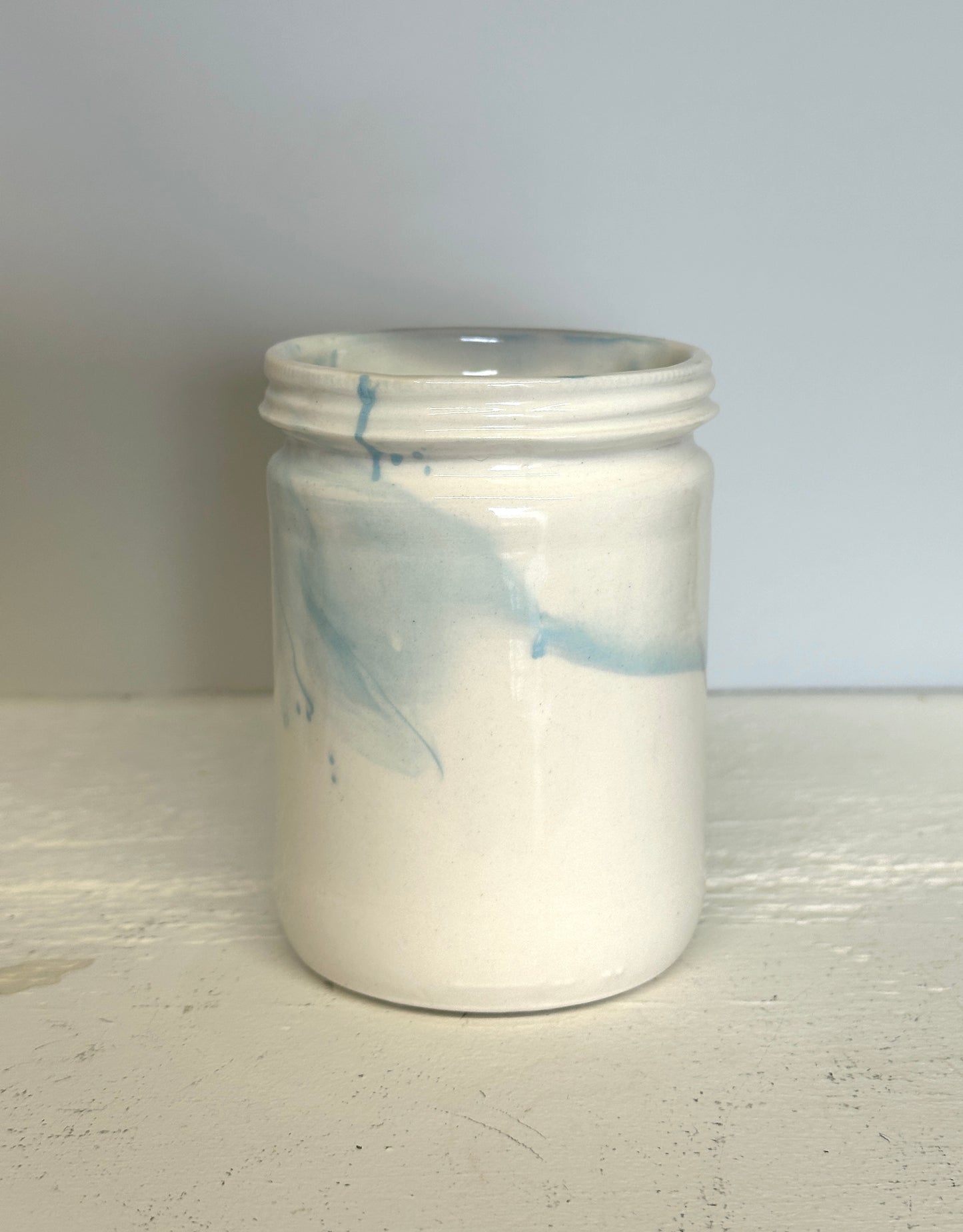 glossy jar shaped cup in white and blue