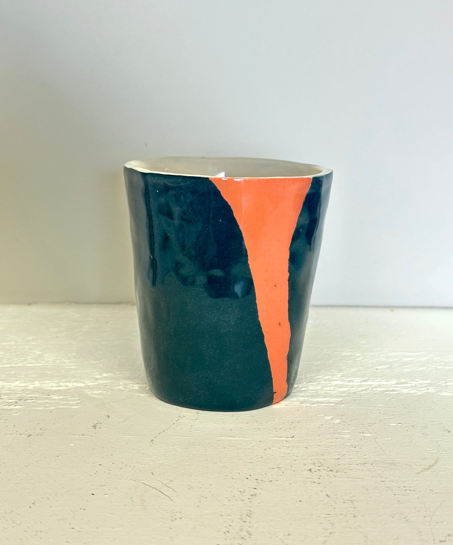 teal and lobster red cup