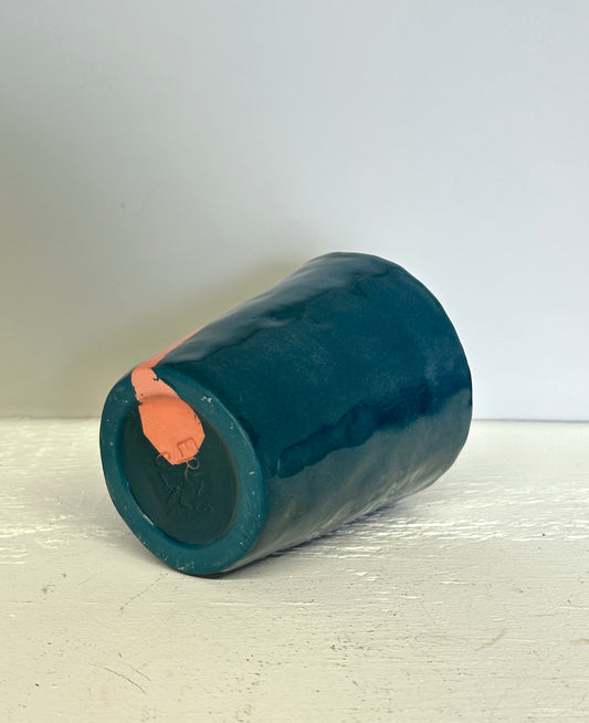 teal and lobster red cup