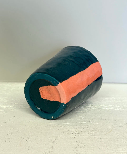 teal and lobster red cup with red interior