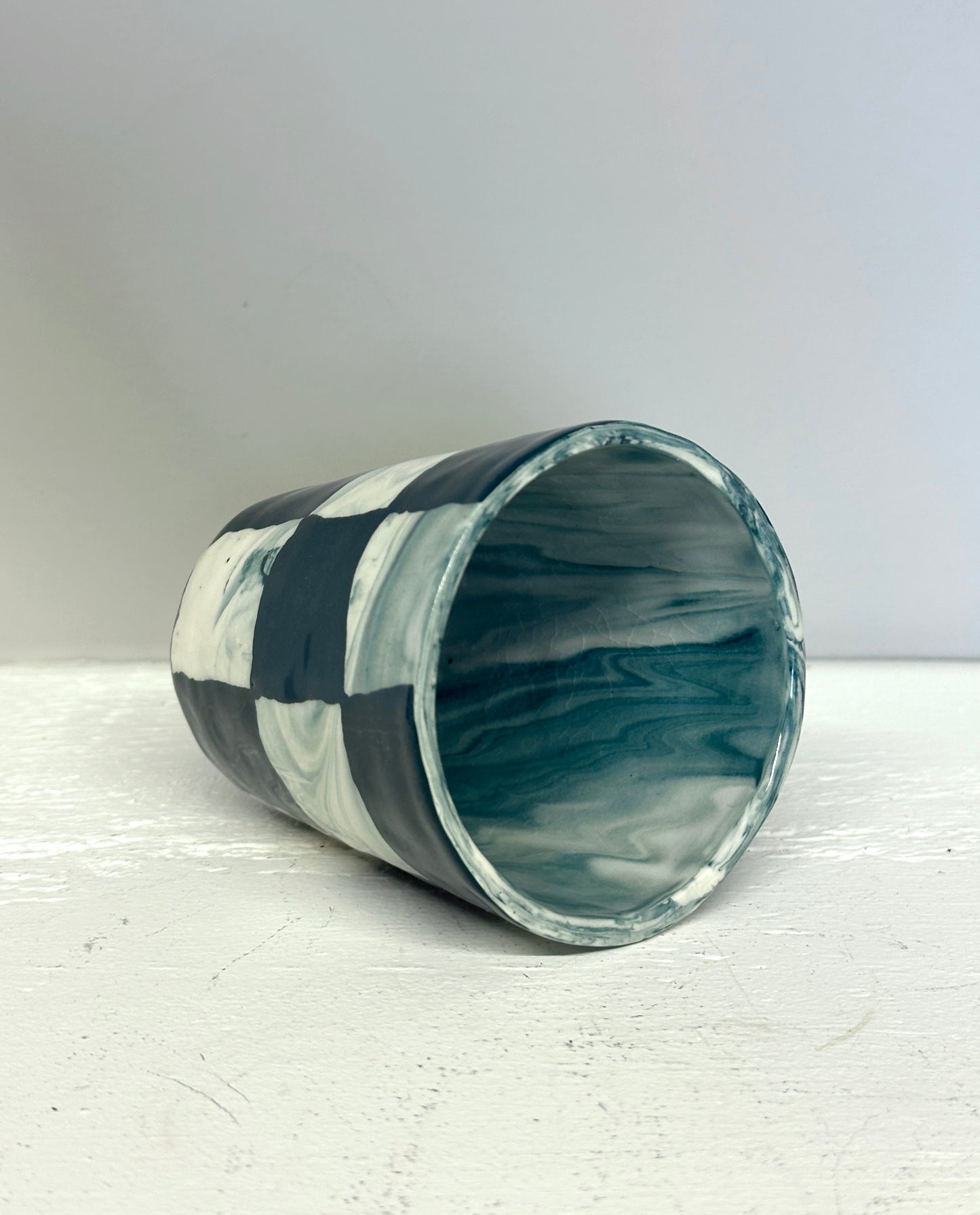 dark teal and white marble checks