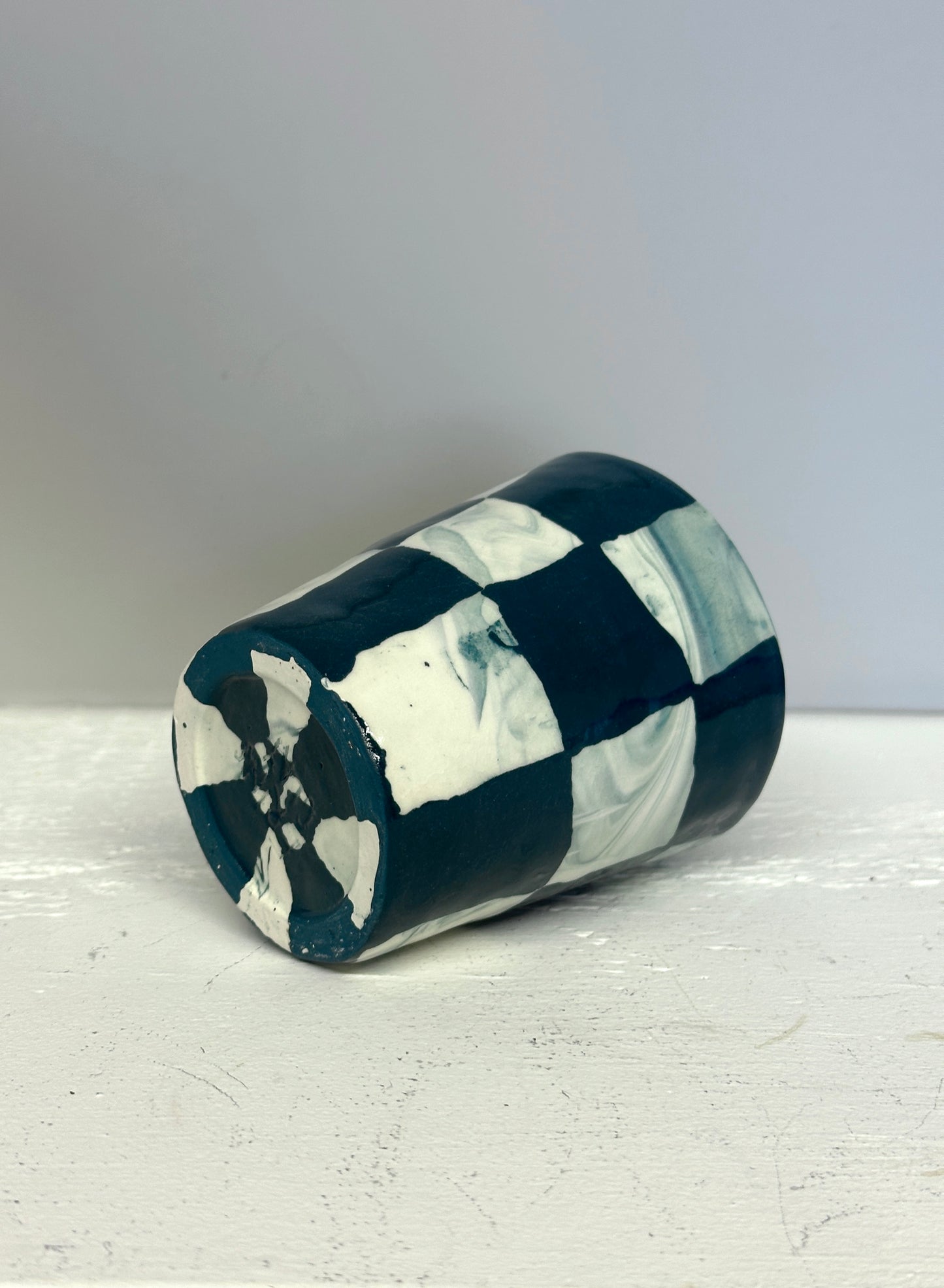 dark teal and white marble checks