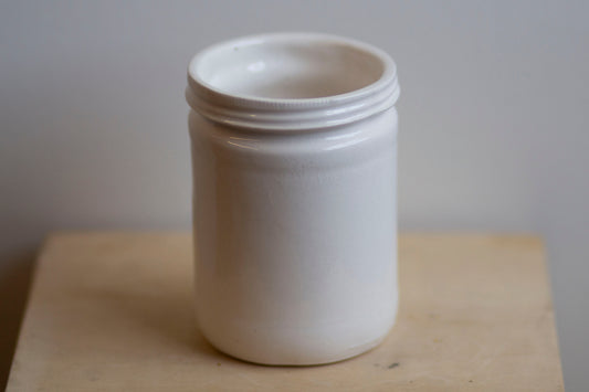 glossy white jar shaped cup
