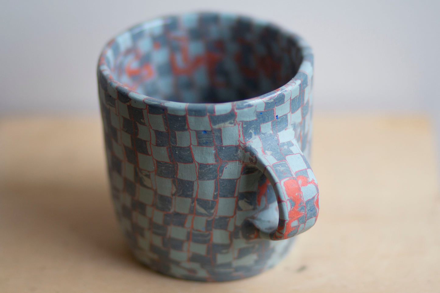 blues and orange mug