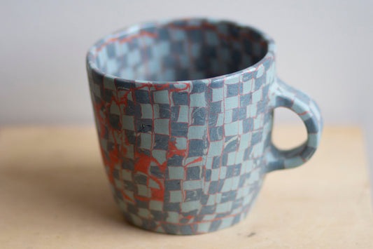 blues and orange mug