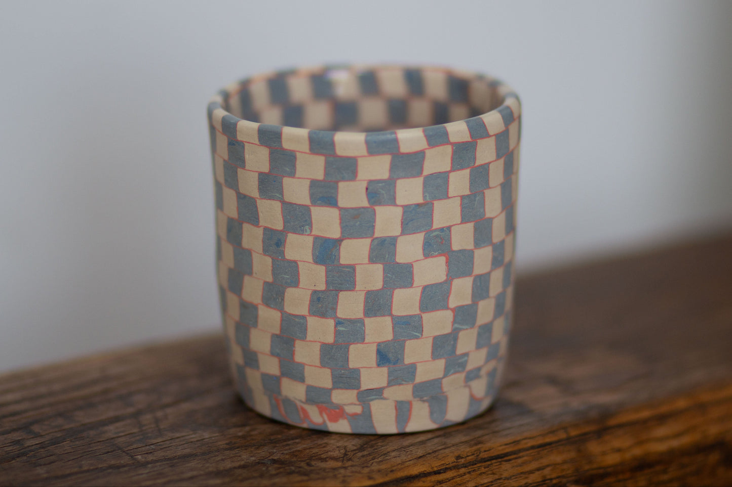 blue and white checkered cup