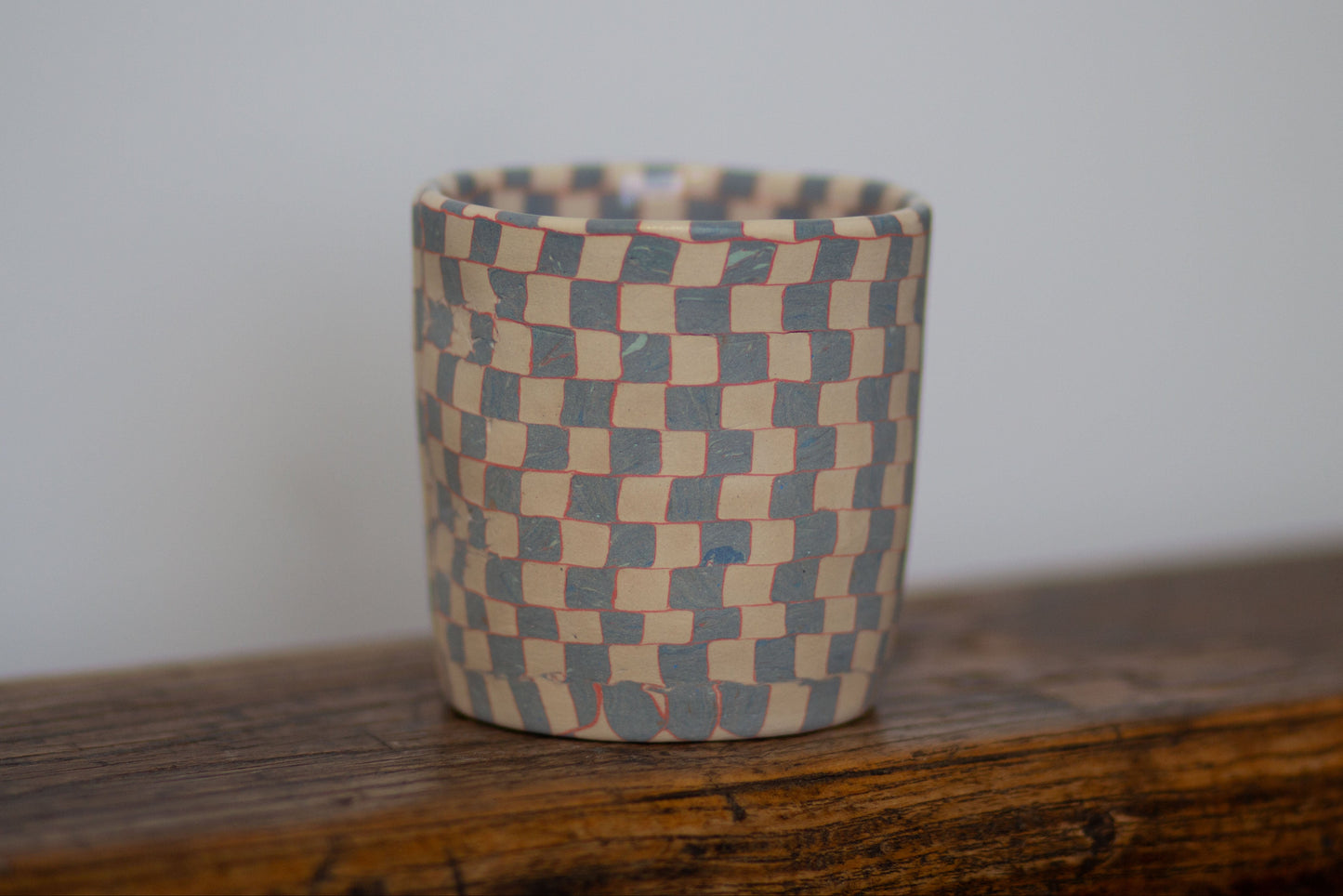 blue and white checkered cup