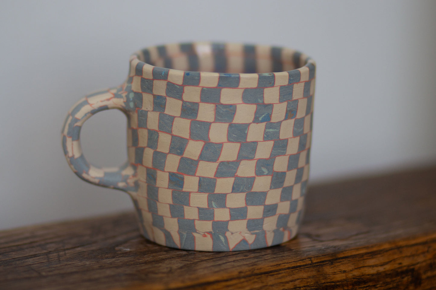 blue and white checkered mug