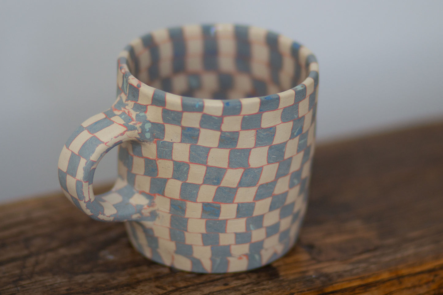 blue and white checkered mug