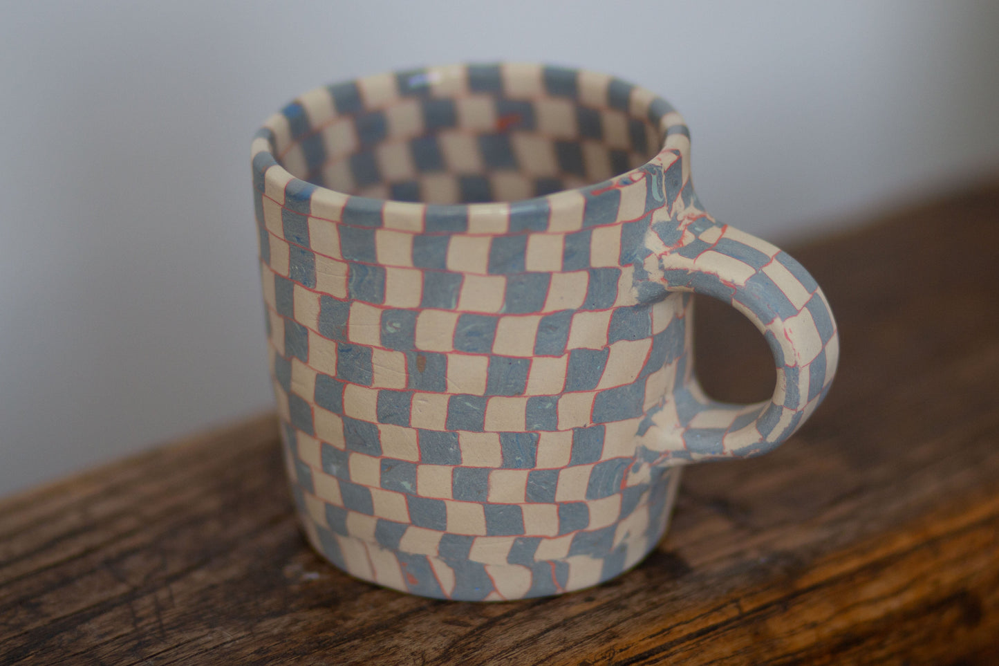 blue and white checkered mug