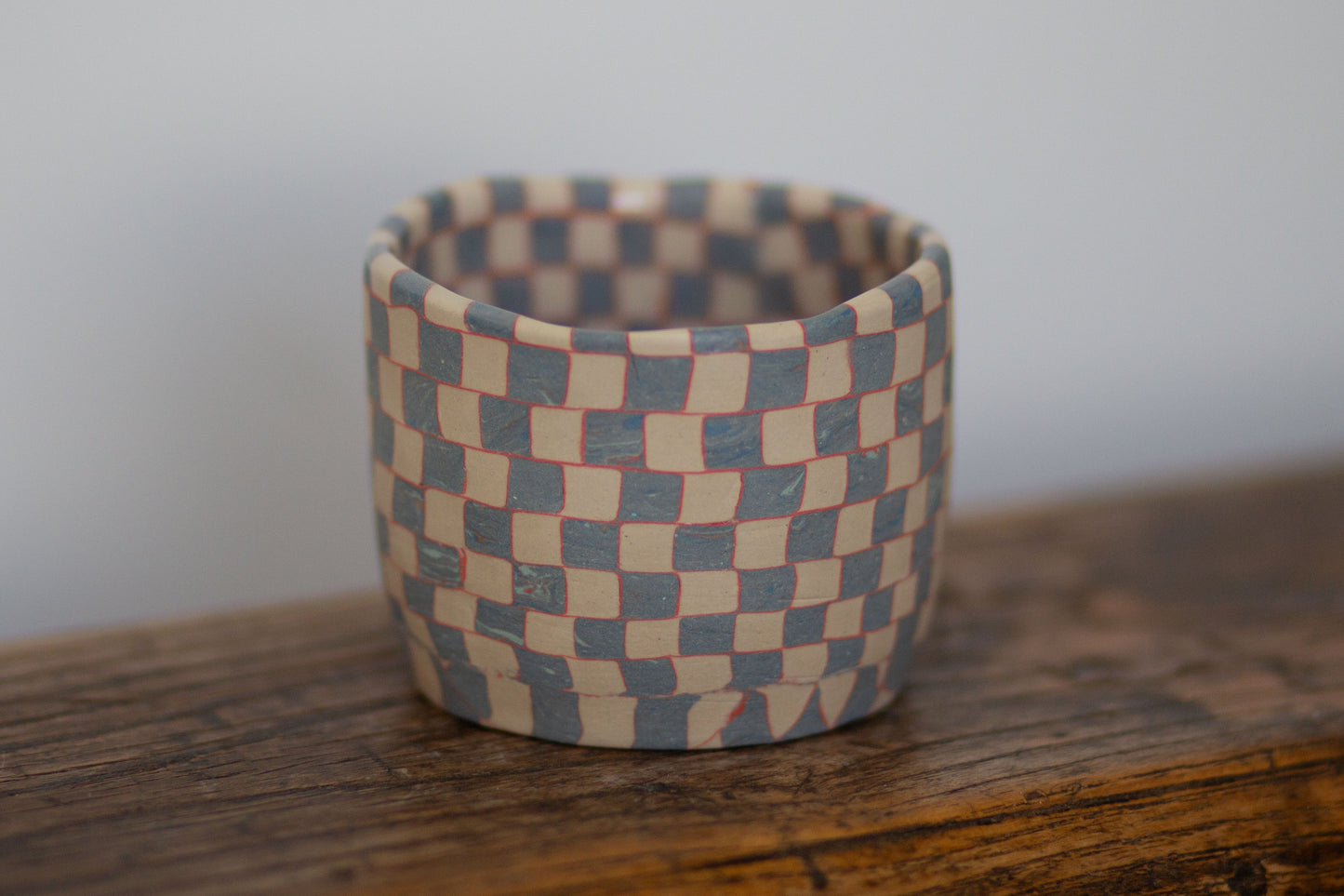 blue and white checkered tea cup