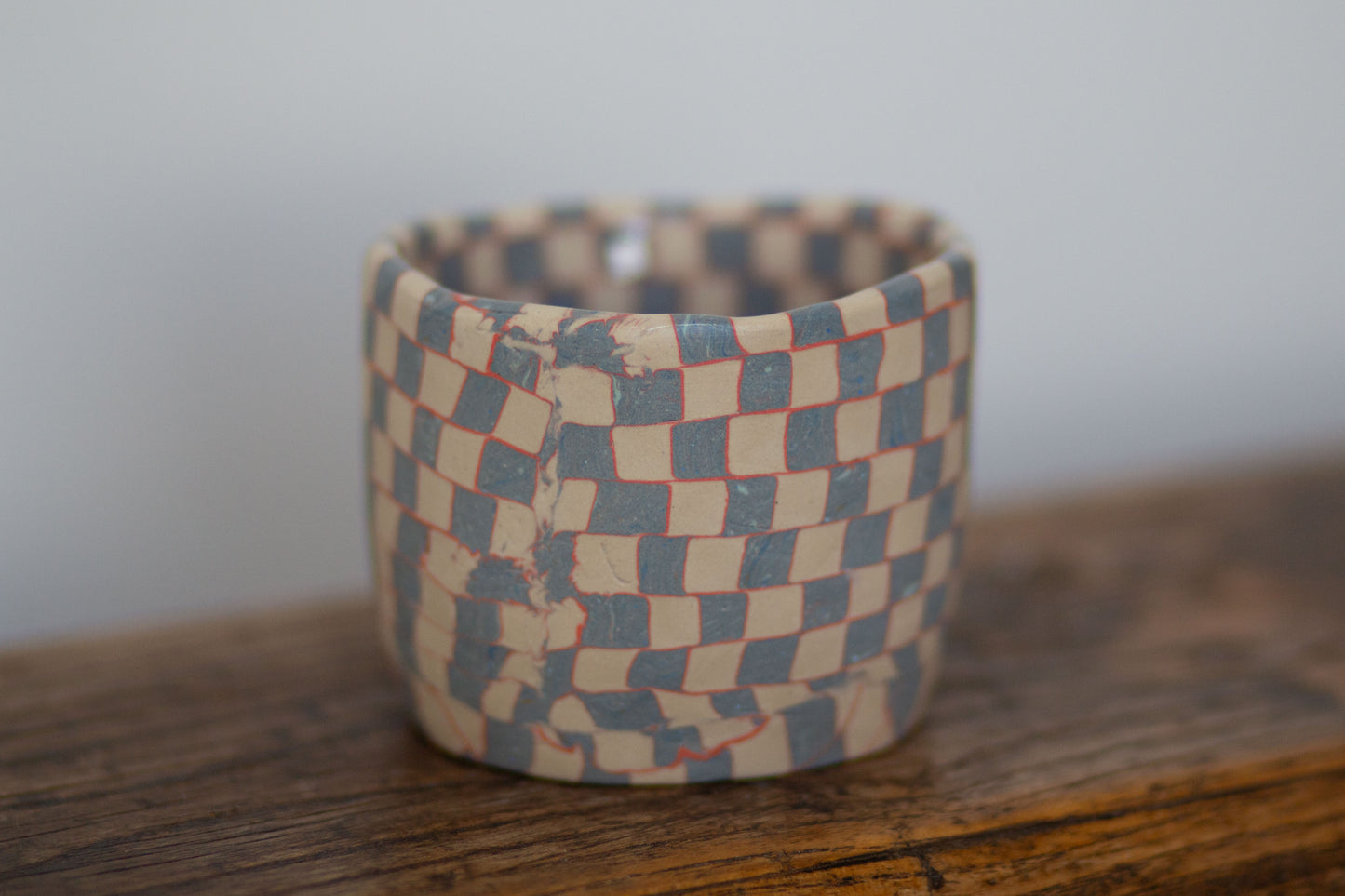 blue and white checkered tea cup