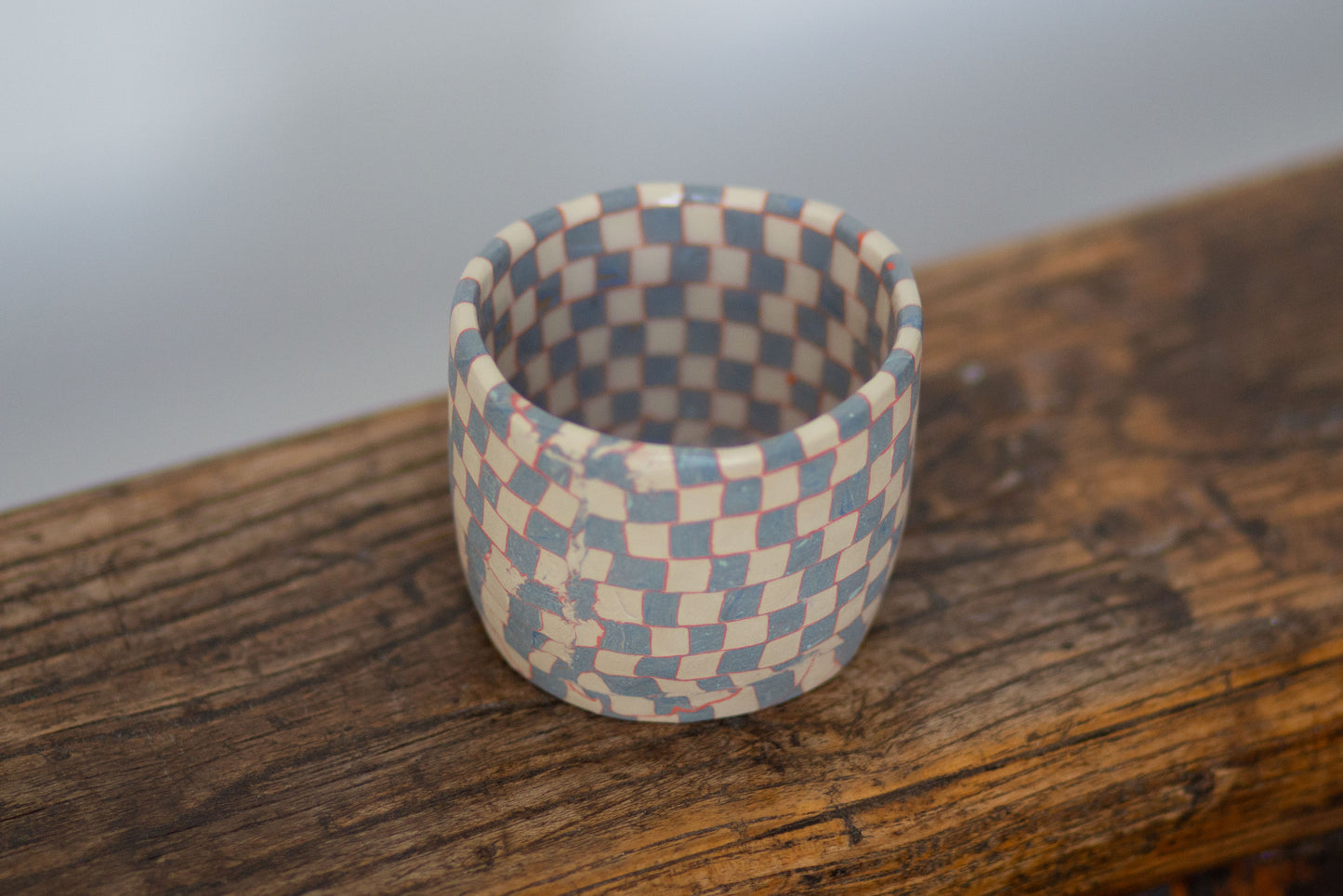 blue and white checkered tea cup