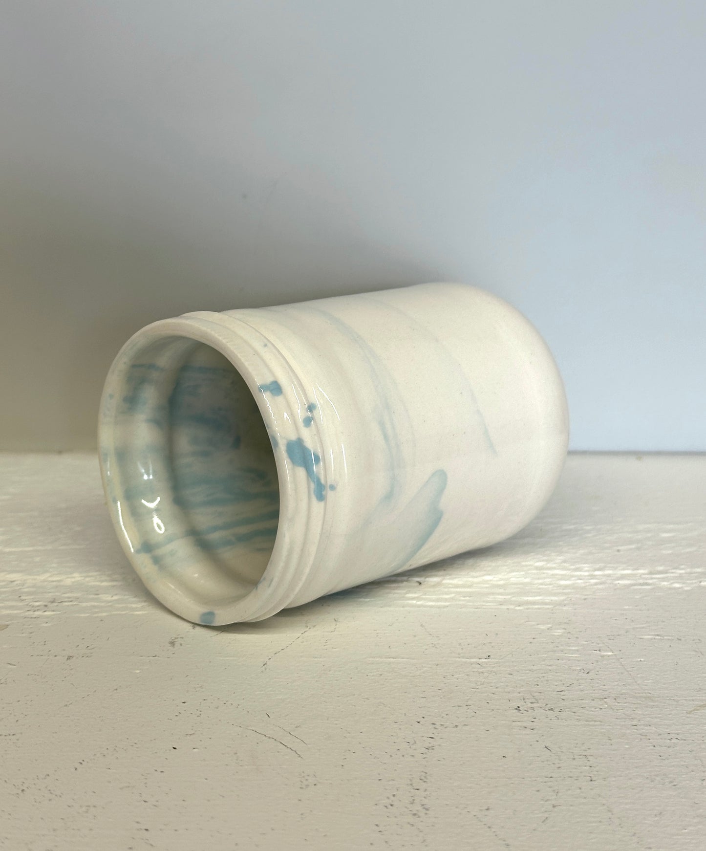 glossy jar shaped cup in white and blue