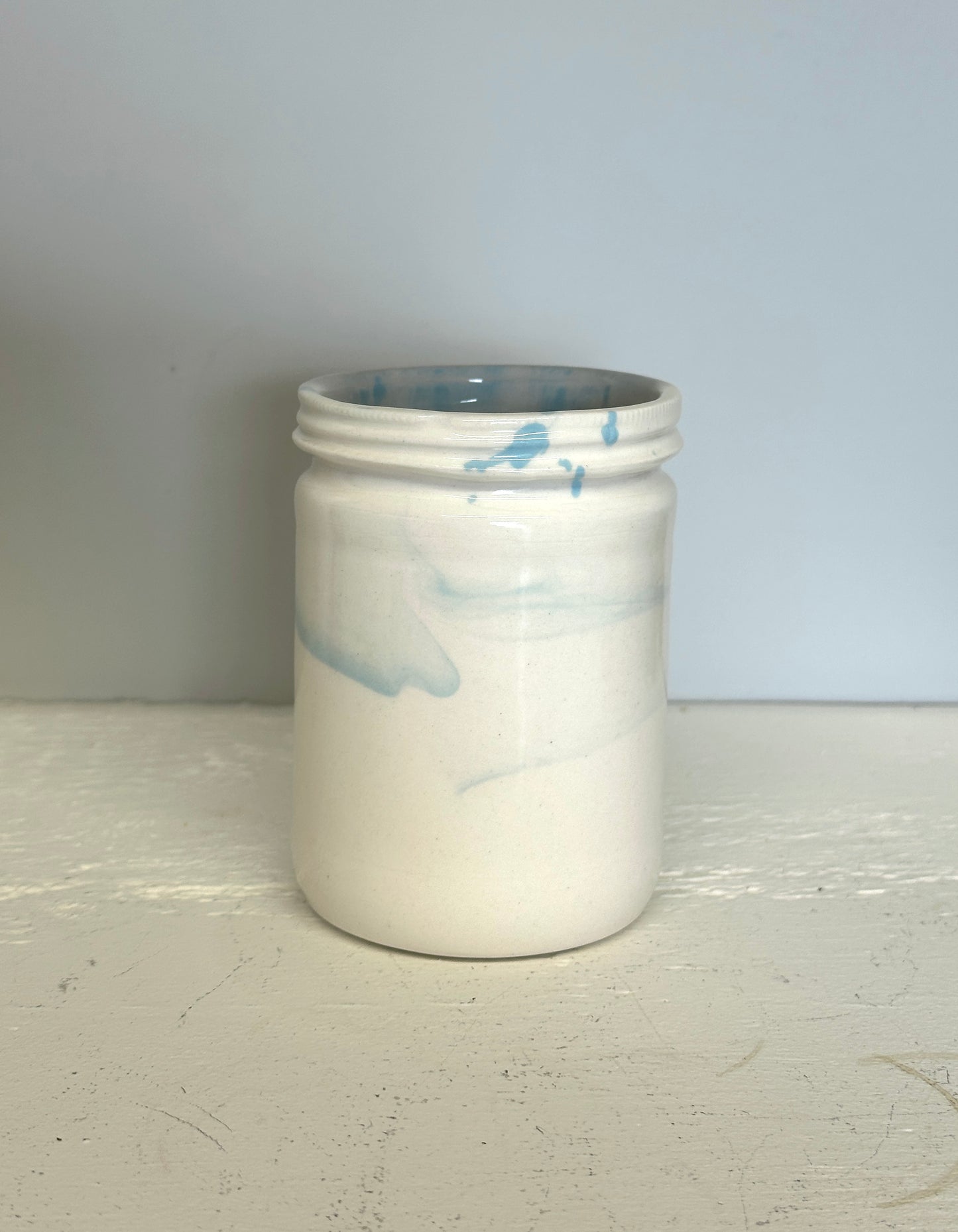 glossy jar shaped cup in white and blue