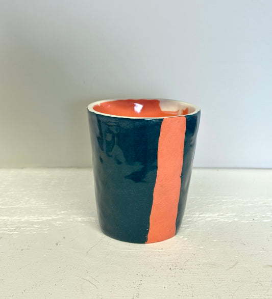 teal and lobster red cup with red interior